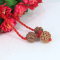"Premium Saraswati Bandha Kavach with two original 4 Mukhi Rudraksha beads and one 6 Mukhi Rudraksha, crafted with spiritual significance and traditional elegance."