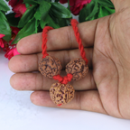 "Premium Saraswati Bandha Kavach with two original 4 Mukhi Rudraksha beads and one 6 Mukhi Rudraksha, crafted with spiritual significance and traditional elegance."