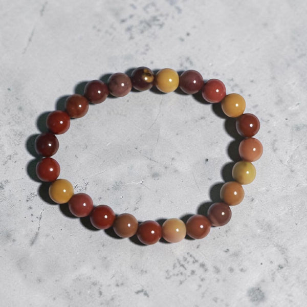 "Premium natural Mookaite Stone Bracelet with polished gemstone beads, crafted for elegance, beauty, and positive energy."
