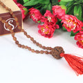 "Premium original 4 Mukhi Rudraksha Mala with 4 Mukhi Meru, crafted with authentic Rudraksha beads for spiritual significance and traditional elegance."