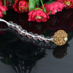 "Premium Rudraksha Kavach for Vehicle Protection with 10 natural Sphatik beads and one original 11 Mukhi Rudraksha, crafted with spiritual significance and traditional elegance."