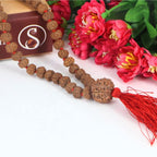 "Premium original 9 Mukhi Rudraksha Mala with 9 Mukhi Meru, crafted with authentic Rudraksha beads for spiritual significance and traditional elegance."