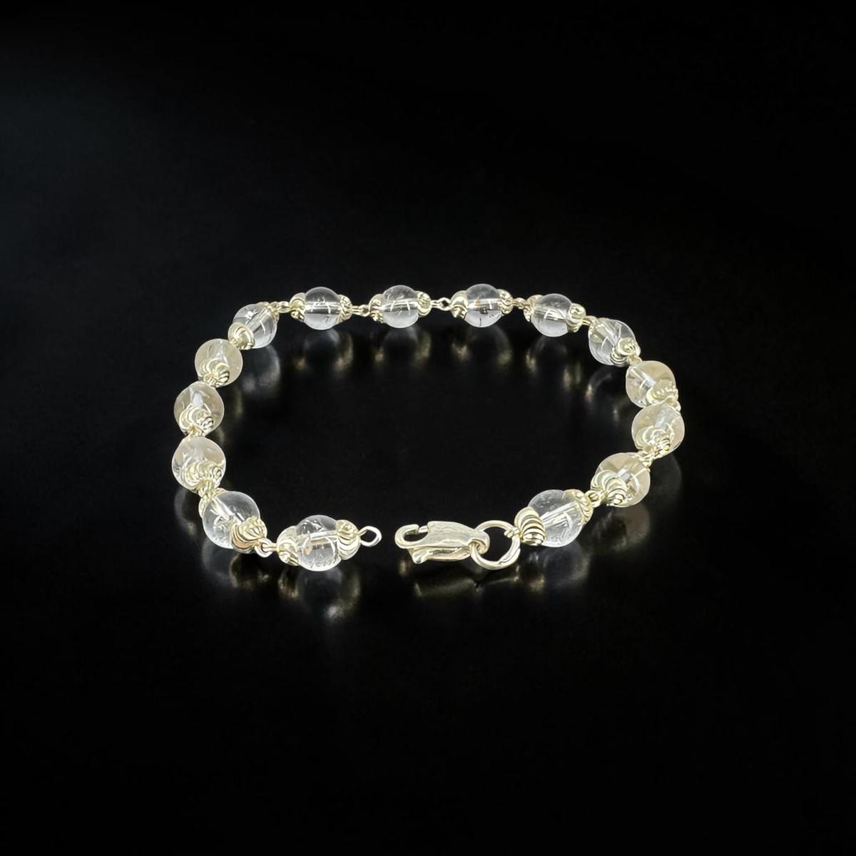 "Sphatik Crystal Bracelet with silver-plated elements, crafted with clear crystal beads in an elegant and stylish design."