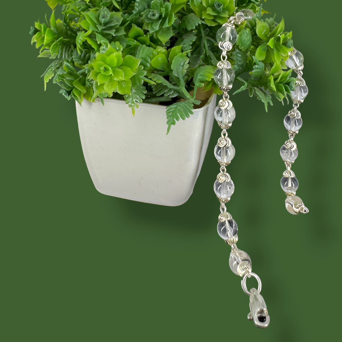 "Sphatik Crystal Bracelet with silver-plated elements, crafted with clear crystal beads in an elegant and stylish design."