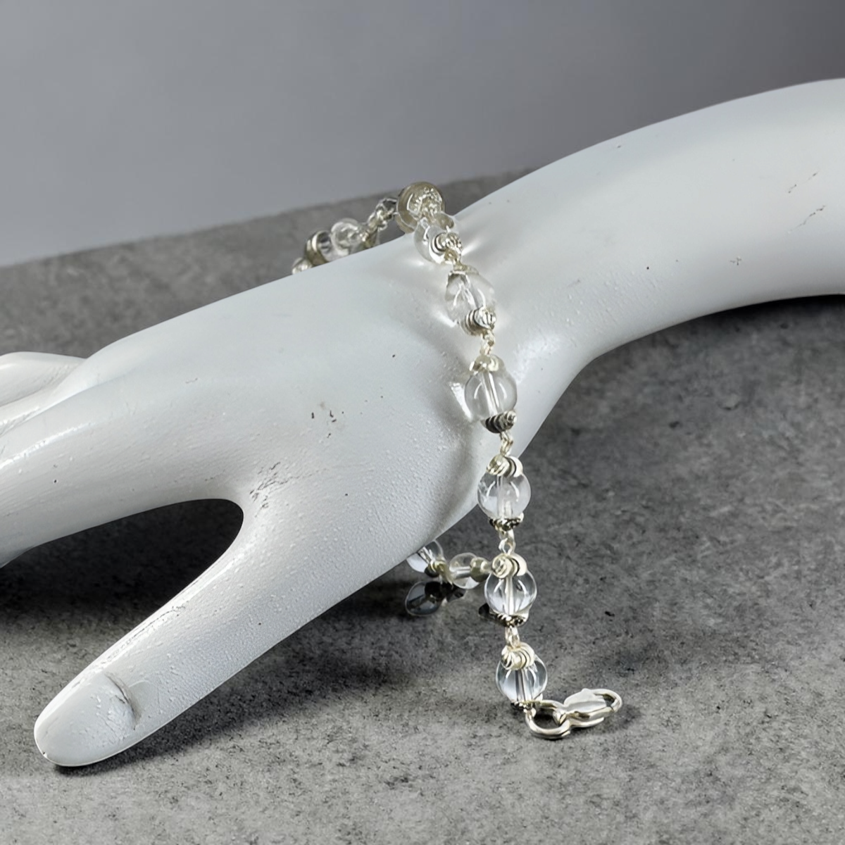 "Sphatik Crystal Bracelet with silver-plated elements, crafted with clear crystal beads in an elegant and stylish design."