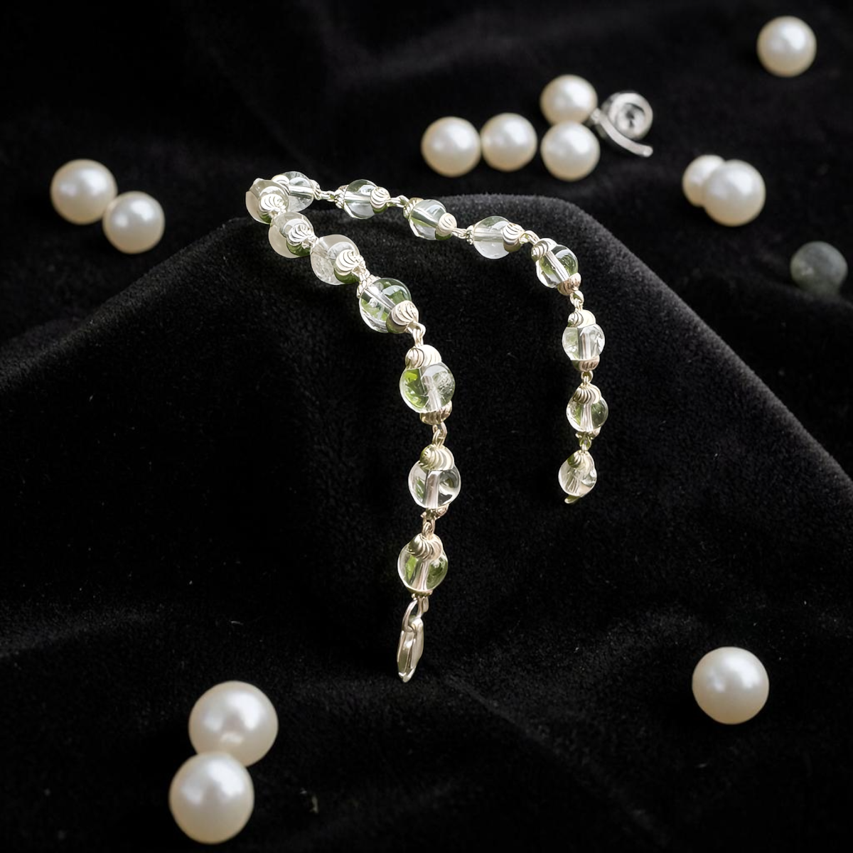 "Sphatik Crystal Bracelet with silver-plated elements, crafted with clear crystal beads in an elegant and stylish design."