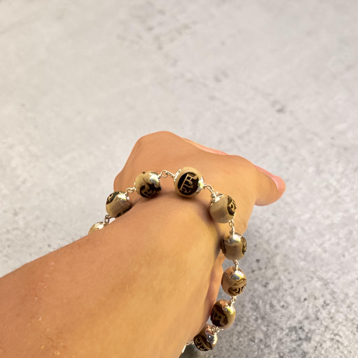 "Ram Naam Tulsi Bracelet with pure silver elements, crafted from sacred Tulsi beads with spiritual and elegant design."