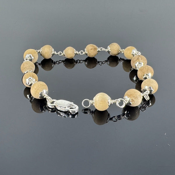 "Premium Clean Bead Tulsi Bracelet with pure silver, made from sacred Tulsi beads for spirituality, devotion, and traditional elegance."