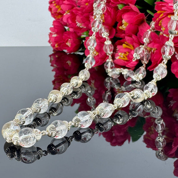 "Premium 54+1 Beads Sphatik Mala with pure silver, featuring natural crystal beads for elegance, clarity, and spiritual significance."