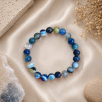 "Premium natural Blue Banded Agate Stone Bracelet with polished gemstone beads, crafted for elegance, beauty, and positive energy."